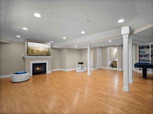 Empty room, Fireplace, Game Room, Interior, Recessed Lighting, Wood Texture Flooring