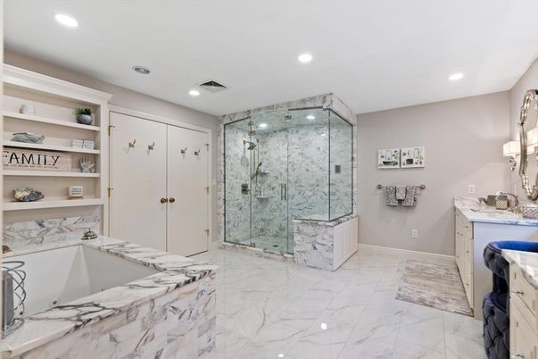 Bathroom, Dual Sink Vanities, Glass Shower, Interior, Marble, Marble Walls, Recessed Lighting