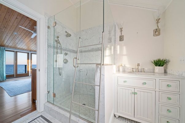 Bathroom, Glass Shower, Interior, Marble Walls, Water, Wood Texture Flooring