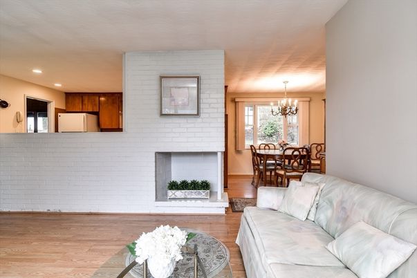 Chandelier, Dining room, Fireplace, Interior, Kitchen, Living room, Recessed Lighting, Stone Walls, Wood Texture Flooring