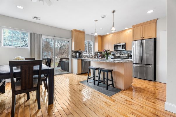 Dining room, Interior, Kitchen, Pendant Lights, Recessed Lighting, Stainless Steel Appliances, Wood Texture Flooring