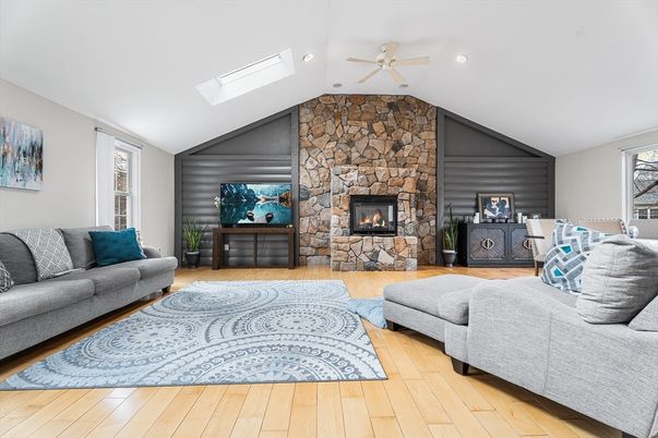Fireplace, Interior, Living room, Recessed Lighting, Stone Walls, Wood Texture Flooring