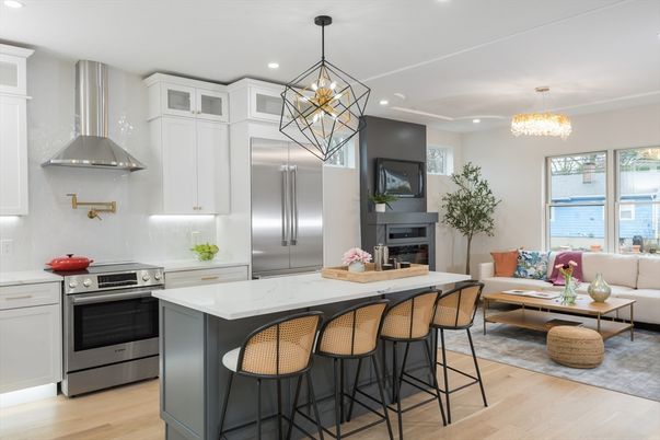 Chandelier, Fireplace, Interior, Kitchen, Living room, Pendant Lights, Recessed Lighting, Stainless Steel Appliances, Wood Texture Flooring