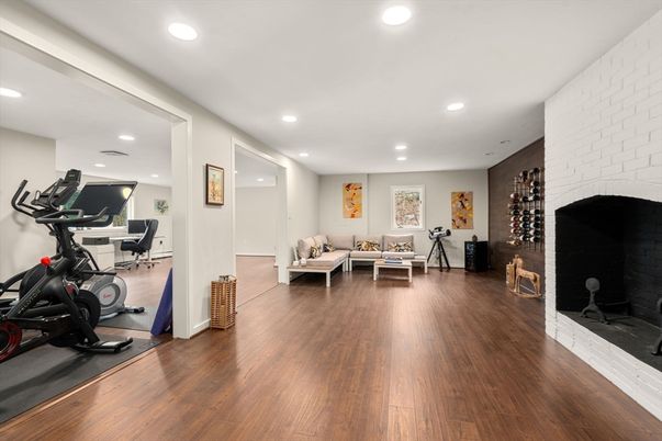 Fitness Equipment, Interior, Living room, Recessed Lighting, Stone Walls, Wood Texture Flooring