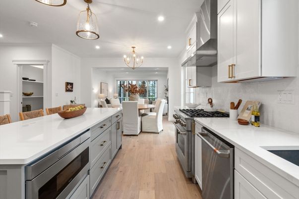 Chandelier, Dining room, Interior, Kitchen, Pendant Lights, Recessed Lighting, Stainless Steel Appliances, Wood Texture Flooring