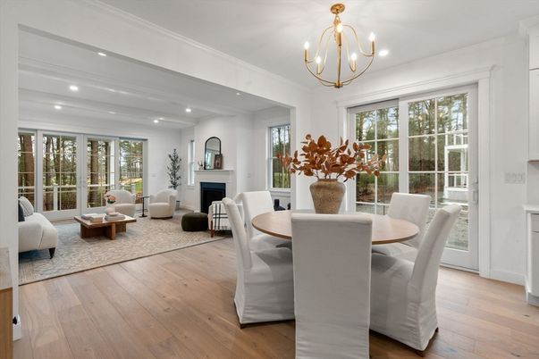 Chandelier, Dining room, Fireplace, Interior, Living room, Pendant Lights, Recessed Lighting, Wood Texture Flooring