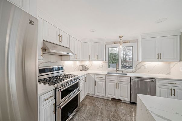 Interior, Kitchen, Marble Walls, Pendant Lights, Recessed Lighting, Stainless Steel Appliances