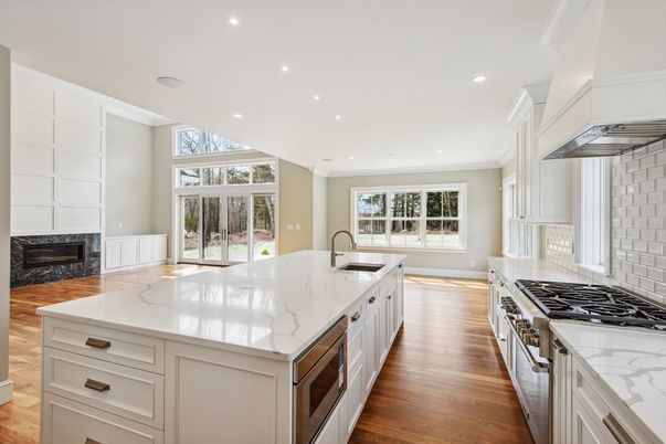 Fireplace, Interior, Kitchen, Recessed Lighting, Stainless Steel Appliances, Wood Texture Flooring