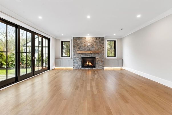 Empty room, Fireplace, Interior, Recessed Lighting, Stone Walls, Wood Texture Flooring