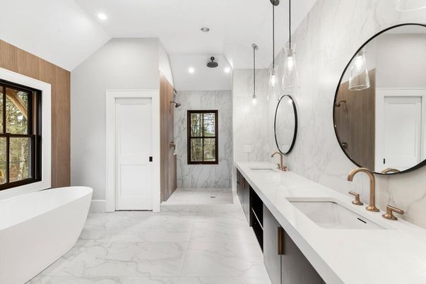 Bathroom, Dual Sink Vanities, Free Standing Baths, Interior, Marble, Marble Walls, Pendant Lights, Recessed Lighting