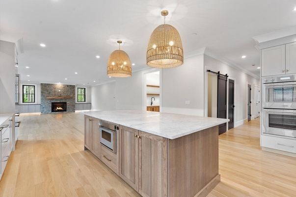 Fireplace, Interior, Kitchen, Living room, Pendant Lights, Recessed Lighting, Stainless Steel Appliances, Wood Texture Flooring