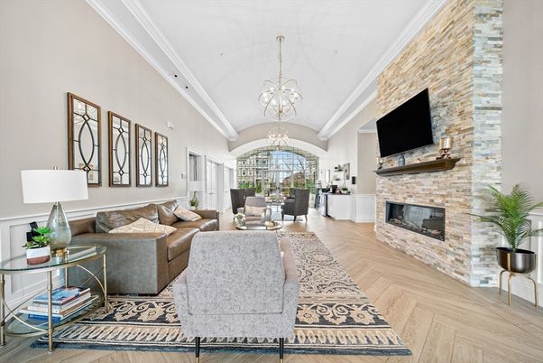 Chandelier, Dining room, Fireplace, Interior, Living room, Pendant Lights, Stone Walls, Wood Texture Flooring