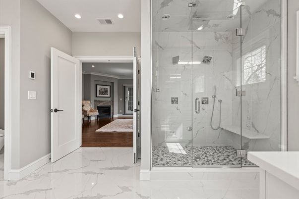 Bathroom, Fireplace, Glass Shower, Interior, Marble, Marble Walls, Recessed Lighting, Wood Texture Flooring