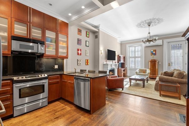 Chandelier, Fireplace, Interior, Kitchen, Living room, Recessed Lighting, Stainless Steel Appliances, Wood Texture Flooring