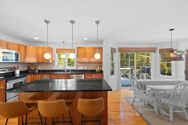 Dining room, Interior, Kitchen, Pendant Lights, Recessed Lighting, Stainless Steel Appliances, Wood Texture Flooring