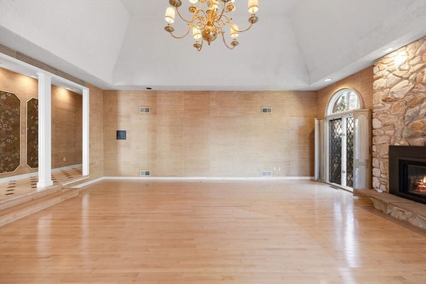 Chandelier, Empty room, Fireplace, Interior, Stone Walls, Wood Texture Flooring