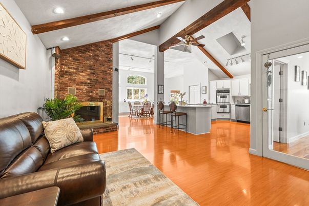 Dining room, Fireplace, Interior, Kitchen, Living room, Recessed Lighting, Stainless Steel Appliances, Stone Walls, Wooden Beams, Wood Texture Flooring
