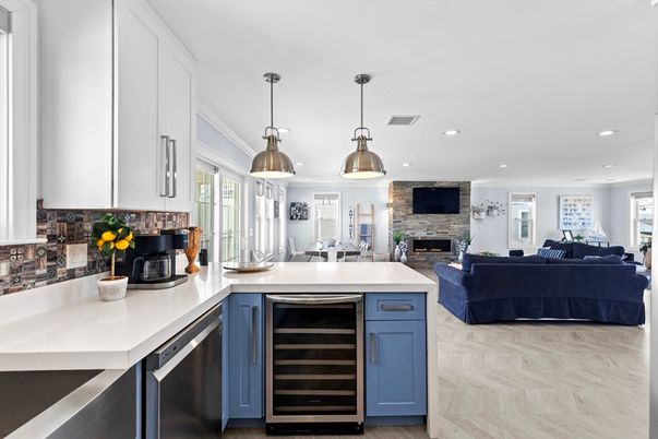 Fireplace, Interior, Kitchen, Living room, Pendant Lights, Recessed Lighting, Stainless Steel Appliances, Stone Walls, Wood Texture Flooring