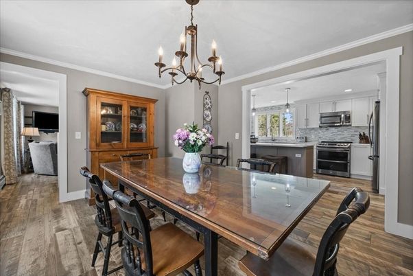 Chandelier, Dining room, Interior, Kitchen, Recessed Lighting, Stainless Steel Appliances, Wood Texture Flooring