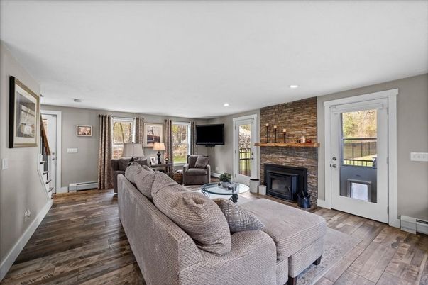 Fireplace, Interior, Living room, Recessed Lighting, Stone Walls, Wood Texture Flooring