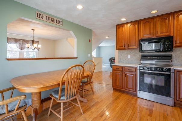 Chandelier, Dining room, Interior, Kitchen, Recessed Lighting, Stainless Steel Appliances, Wood Texture Flooring