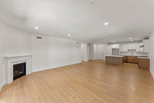 Empty room, Fireplace, Interior, Kitchen, Pendant Lights, Recessed Lighting, Wood Texture Flooring