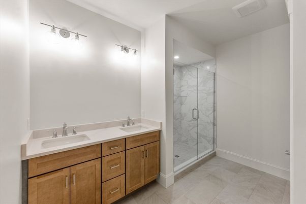 Bathroom, Dual Sink Vanities, Glass Shower, Interior, Marble Walls, Recessed Lighting