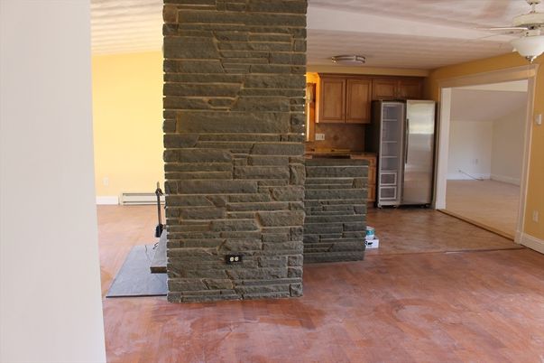 Empty room, Fireplace, Interior, Kitchen, Stainless Steel Appliances, Stone Walls