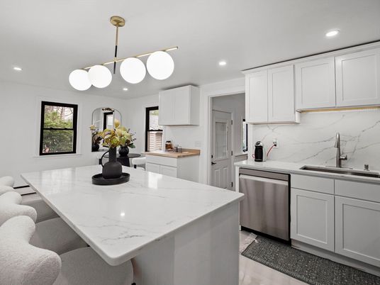 Interior, Kitchen, Marble Walls, Recessed Lighting, Stainless Steel Appliances