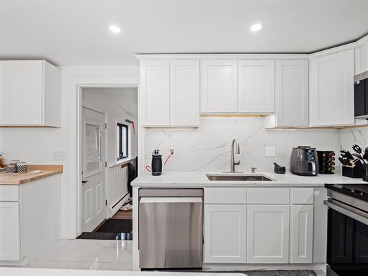 Interior, Kitchen, Marble Walls, Recessed Lighting, Stainless Steel Appliances