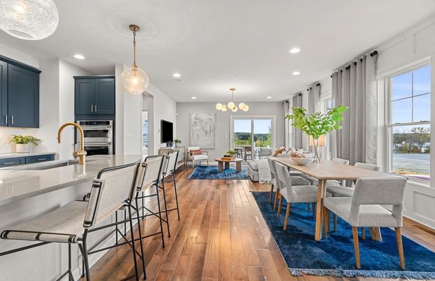 Chandelier, Dining room, Interior, Kitchen, Living room, Pendant Lights, Recessed Lighting, Stainless Steel Appliances, Wood Texture Flooring