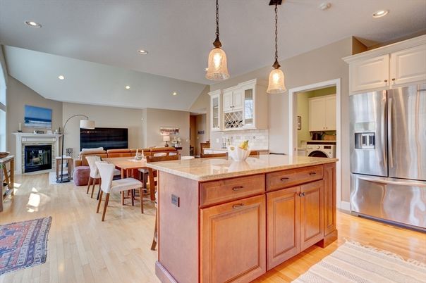 Dining room, Fireplace, Interior, Kitchen, Pendant Lights, Recessed Lighting, Stainless Steel Appliances, Wood Texture Flooring