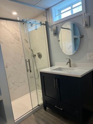 Bathroom, Glass Shower, Interior, Marble Walls, Recessed Lighting, Wood Texture Flooring