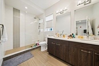 Bathroom, Dual Sink Vanities, Glass Shower, Interior, Recessed Lighting, Wood Texture Flooring