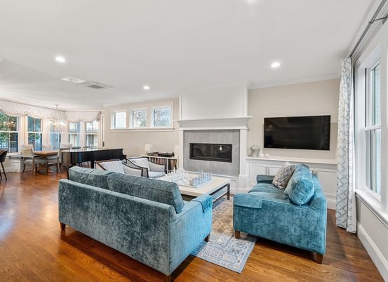 Chandelier, Dining room, Fireplace, Interior, Living room, Pendant Lights, Recessed Lighting, Wood Texture Flooring