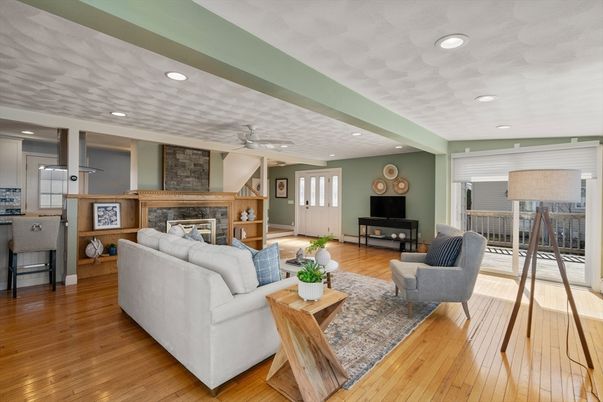 Fireplace, Interior, Living room, Recessed Lighting, Stone Walls, Wood Texture Flooring