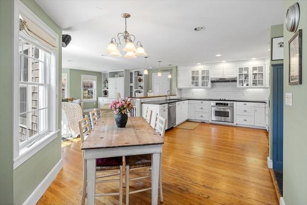 Chandelier, Dining room, Interior, Kitchen, Pendant Lights, Recessed Lighting, Stainless Steel Appliances, Wood Texture Flooring