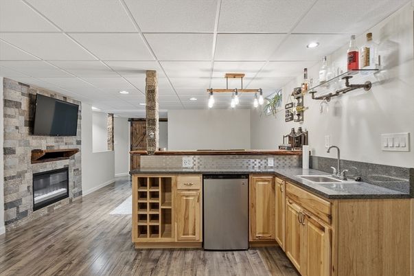 Fireplace, Interior, Kitchen, Pendant Lights, Recessed Lighting, Stone Walls, Wood Texture Flooring