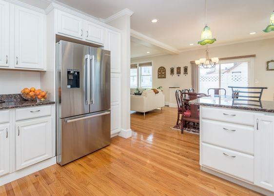 Chandelier, Dining room, Interior, Kitchen, Living room, Pendant Lights, Recessed Lighting, Stainless Steel Appliances, Wood Texture Flooring