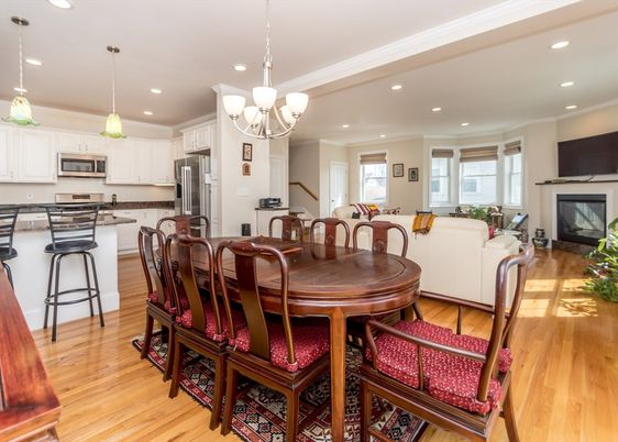 Chandelier, Dining room, Fireplace, Interior, Kitchen, Living room, Pendant Lights, Recessed Lighting, Stainless Steel Appliances, Wood Texture Flooring