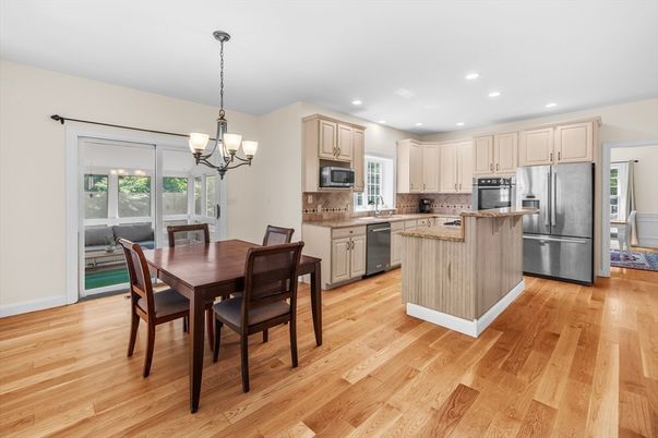 Chandelier, Dining room, Interior, Kitchen, Pendant Lights, Recessed Lighting, Stainless Steel Appliances, Wood Texture Flooring