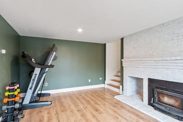 Fireplace, Fitness Equipment, Interior, Recessed Lighting, Stone Walls, Wood Texture Flooring