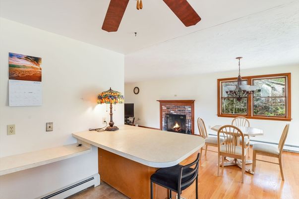 Dining room, Fireplace, Interior, Pendant Lights, Wood Texture Flooring