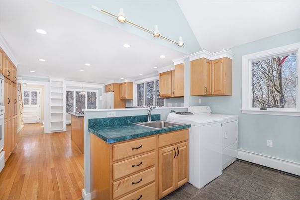 Interior, Kitchen, Recessed Lighting, Washer, Wood Texture Flooring
