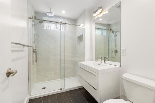 Bathroom, Glass Shower, Interior, Marble Walls, Recessed Lighting, Wood Texture Flooring