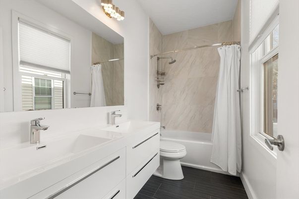 Bathroom, Dual Sink Vanities, Interior, Marble Walls, Wood Texture Flooring