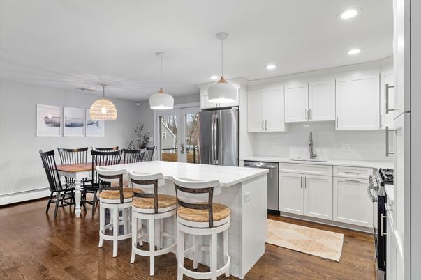 Dining room, Interior, Kitchen, Pendant Lights, Recessed Lighting, Stainless Steel Appliances, Wood Texture Flooring