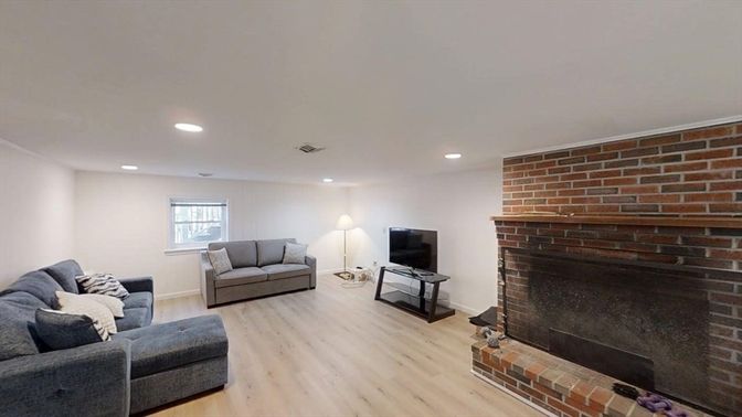 Fireplace, Interior, Living room, Recessed Lighting, Stone Walls, Wood Texture Flooring
