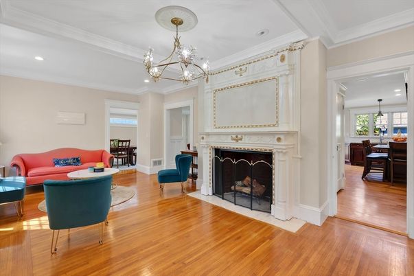 Chandelier, Dining room, Fireplace, Interior, Living room, Pendant Lights, Recessed Lighting, Wood Texture Flooring