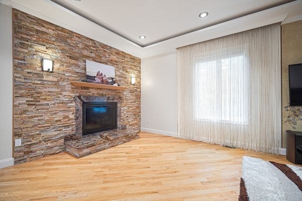 Empty room, Fireplace, Interior, Recessed Lighting, Stone Walls, Wood Texture Flooring